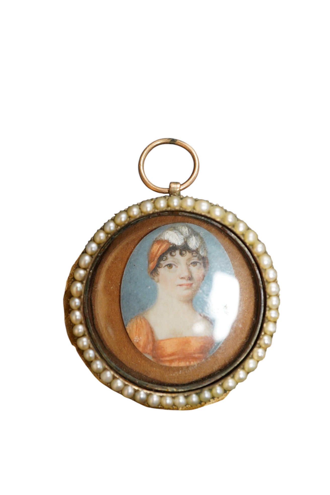 Regency School, Oval portrait miniature of a lady, watercolour on ivory, housed in a split pearl and yellow metal frame (untested) inscribed Anne Groves?, obt. 1800, aged 48, 3.5cm in diameter IVORY SUBMISSION L8EYBNUP